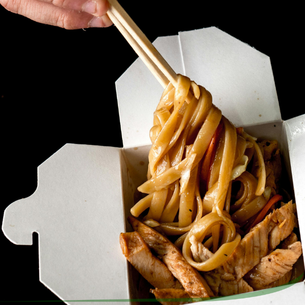 spaghetti meal in a takeout box