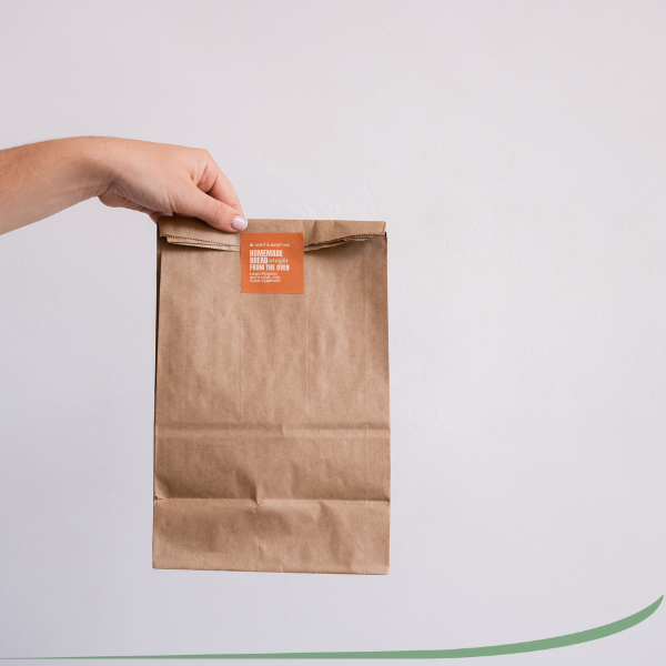 a brown package being held by a hand