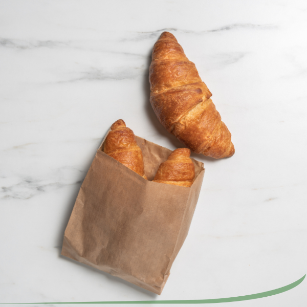 a bag of croissants with one croissant out