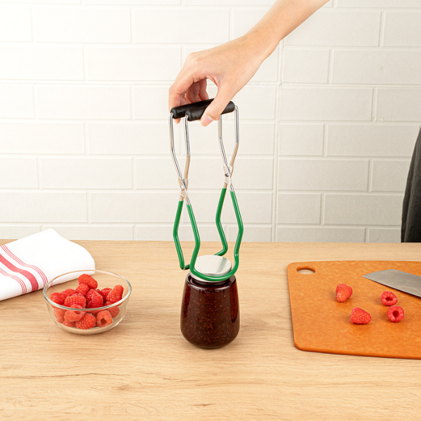 Jar lifter lifting a jar of sauce