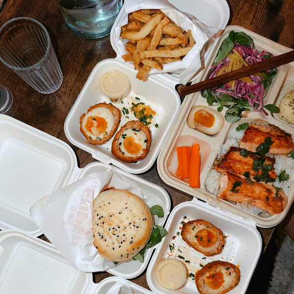 different cuisine food in takeout packaging