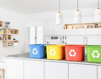 color-coded recycle bins on countertop
