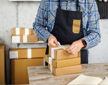 a man packaging a box