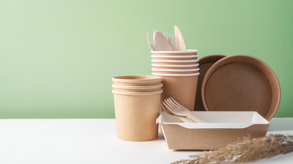 disposable tableware kraft paper on light macha green background