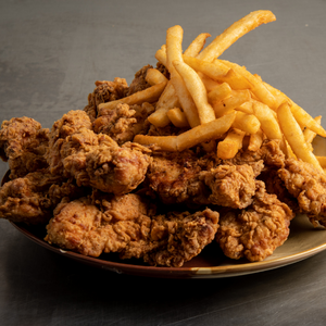 Plate of fried chicken and fries