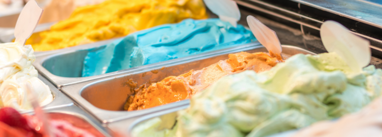 Colorful ice cream in metal pans