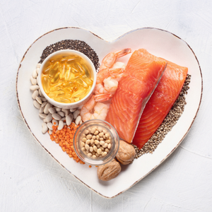 Omega-3 foods and vitamins on heart plate