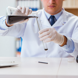 Scientist mixing chemicals