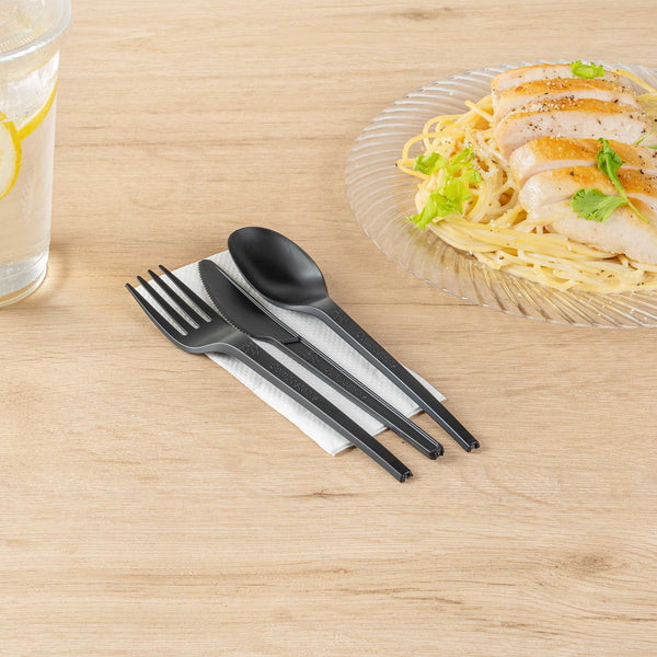 Basic Nature Black CPLA Plastic Cutlery Set - White Napkin, Heat-Resistant, Compostable - 8 3/4