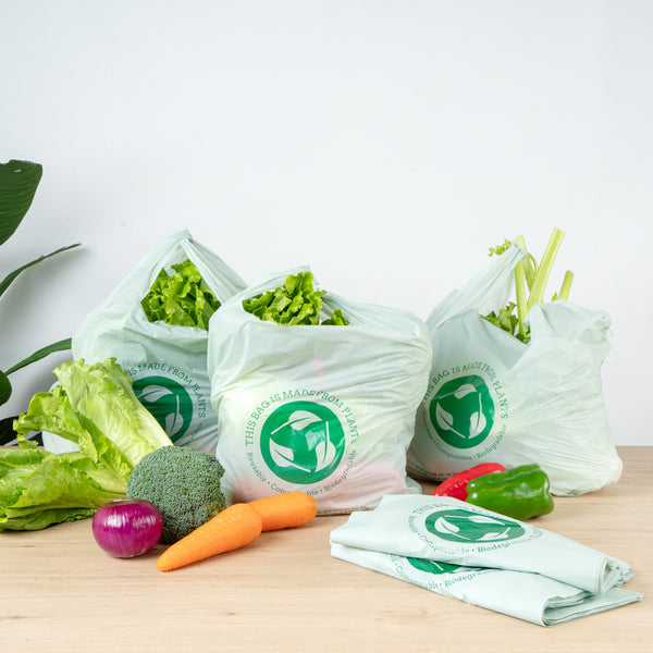 plastic bags made from plants Basic Nature Green Plastic T-Shirt Bag - 1/6 Size, Compostable - 12" x 6 1/2" x 22"
