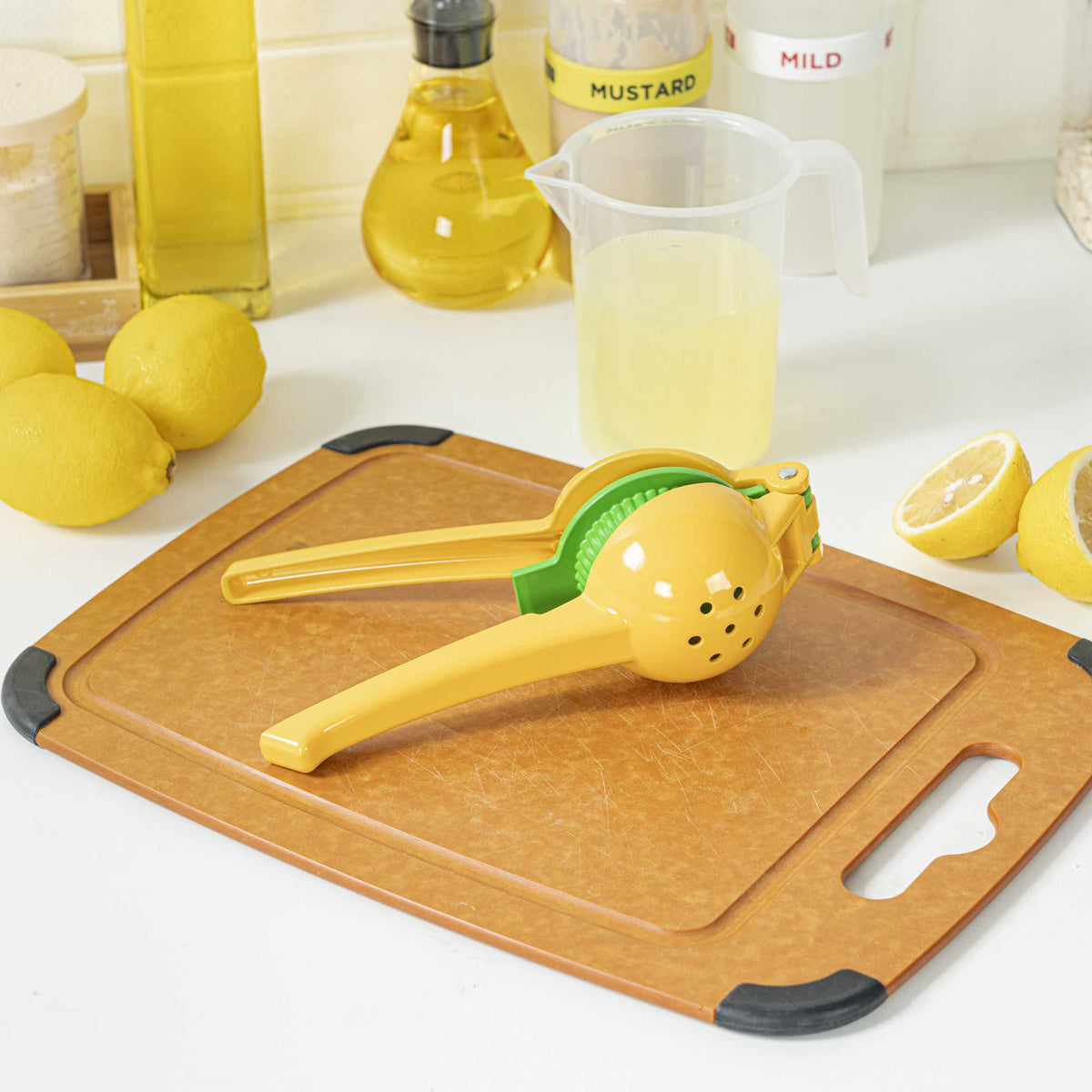 Met Lux Yellow and Green Handheld Aluminum Lemon Squeezer / Juicer - 8 3/4" x 3" x 1 3/4" - 1 count box
