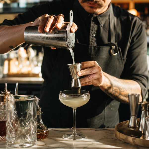 Bar Lux cocktail tools including jigger and shaker in use — essential equipment for running a bar