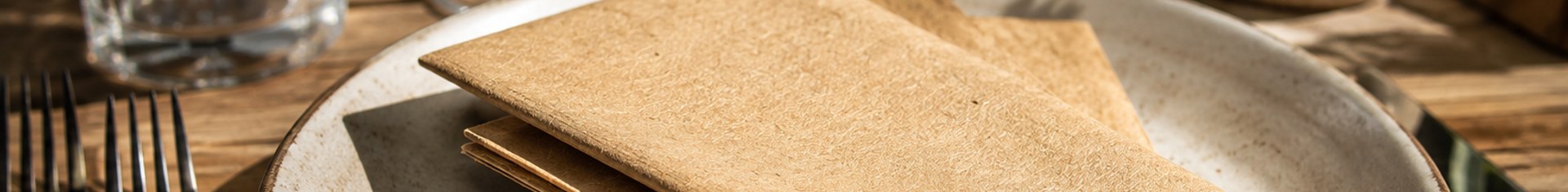 Eco friendly napkins made from recycled kraft paper on a restaurant table setting