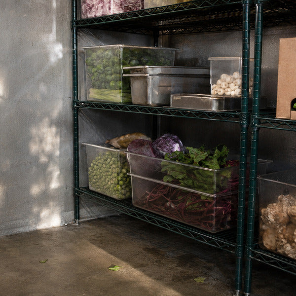 Epoxy-coated wire shelving in a restaurant walk-in cooler with food stored six inches above the floor
