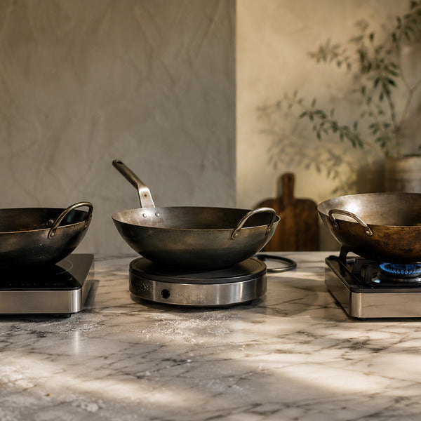 Flat-bottom and round-bottom wok pan bases compared on induction, electric, and gas stoves