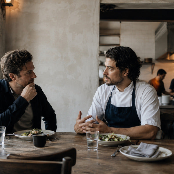 Restaurant owner interviewing a candidate on how to hire a chef for their kitchen team