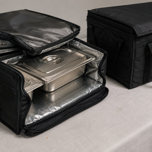 Insulated food carriers and catering bags keeping food at safe temperatures in transit