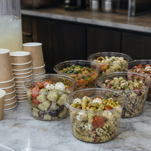 Make-ahead picnic salads in portion cups with a lemonade station and paper cups