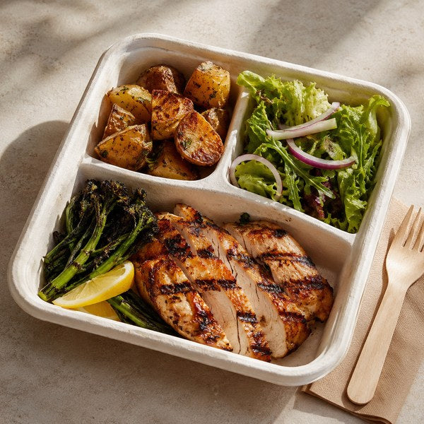 Multi-compartment bagasse tray holding a combo meal, an eco-friendly takeout container for orders with separate components