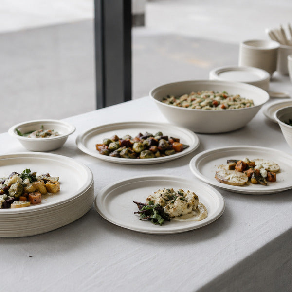 Bagasse plates and bowls made from sugarcane fiber, PFAS free supplies for high-volume catering