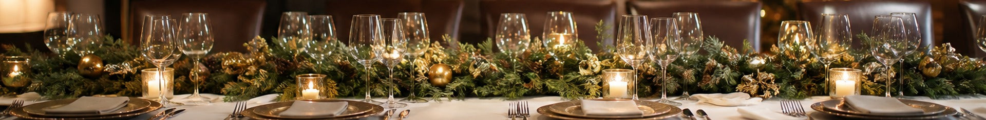 Festive private dining room set for a restaurant holiday party with garland and place settings