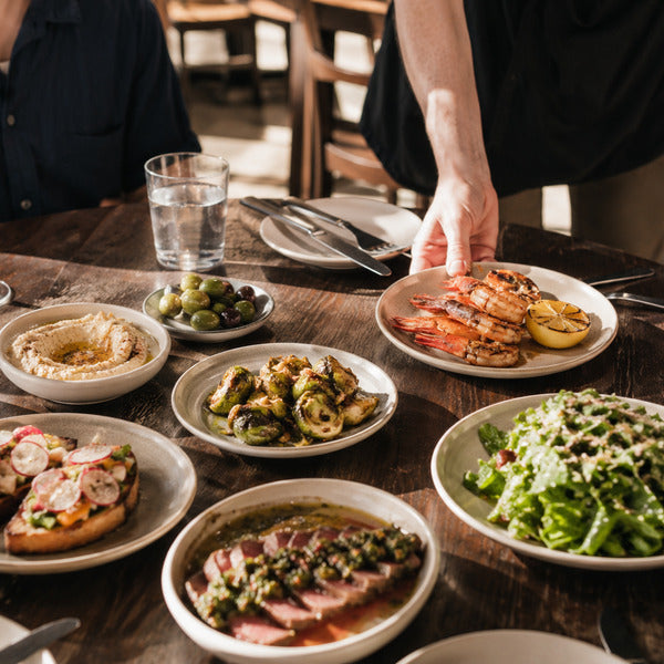 Shareable small plates arranged for a group, an example of menu presentation built for family-style dining