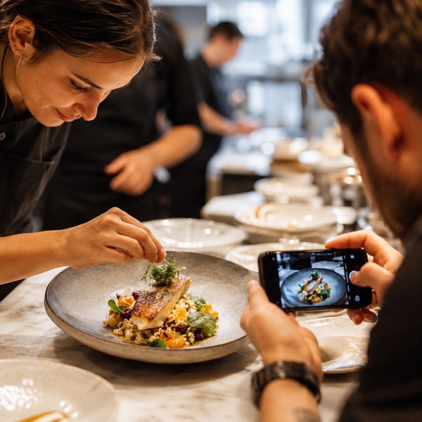 Staff filming signature plating for short-form video, one of the top restaurant marketing ideas for 2026