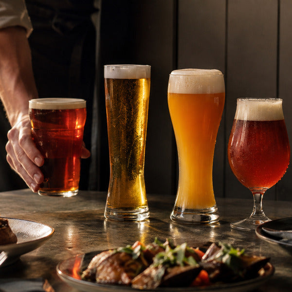 Different types of beer glasses for different types of beer — nonic pint, pilsner, weizen, and tulip