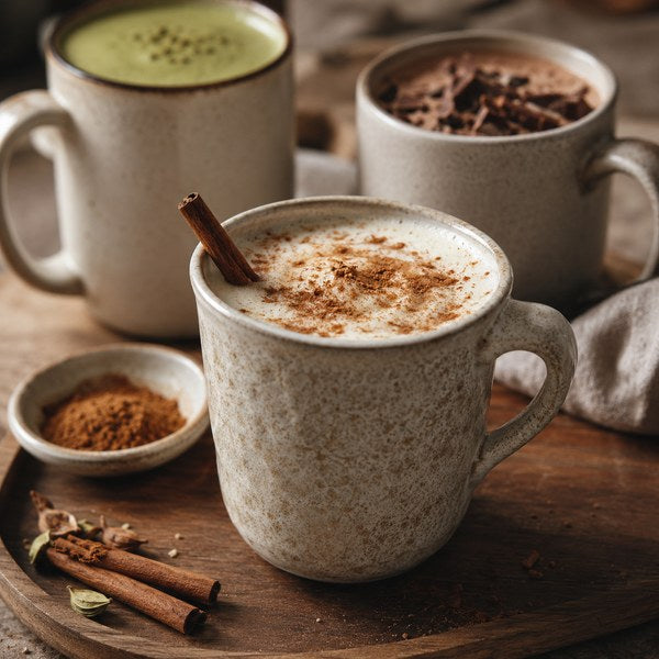 Hot cocoa and spiced cider served in paper hot cups — winter drink menu ideas in a cafe setting